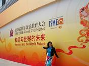 Ms. R. Gutman is by the entrance of the Olympic Village Conference Center, in Beijing, the venue that hosted the 29th World Conference of ISME, Aug, 2010