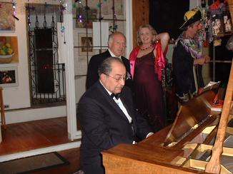 Arnold Kloian improvising on the piano at the New Year's Arts and Music Salon, benefit for CHARISMA Foundation, produced by !Class Act Productions